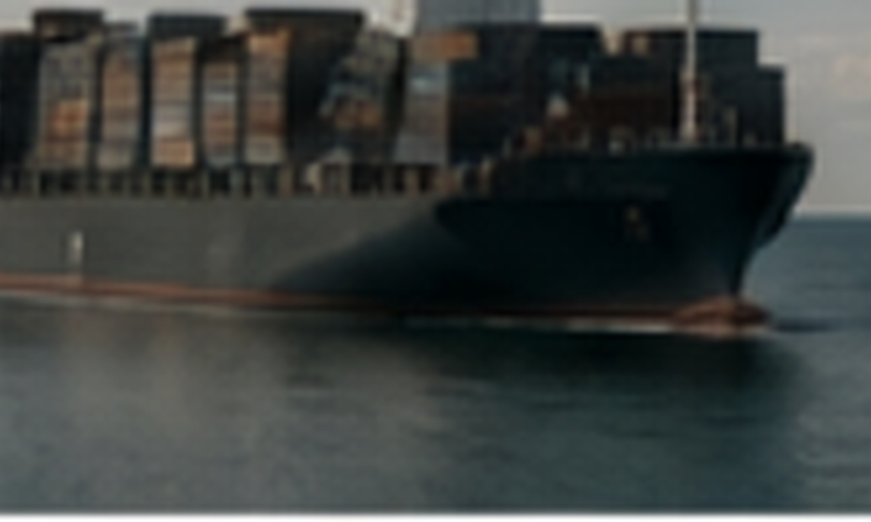 Container vessel carrying project cargo at sea