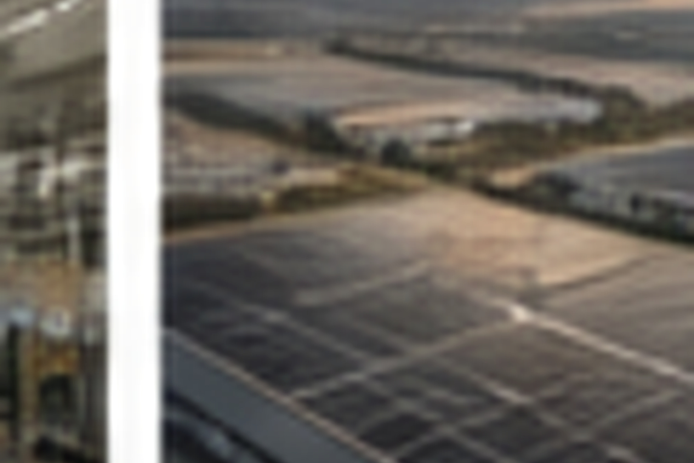 Aerial view of a large industrial rooftop solar field